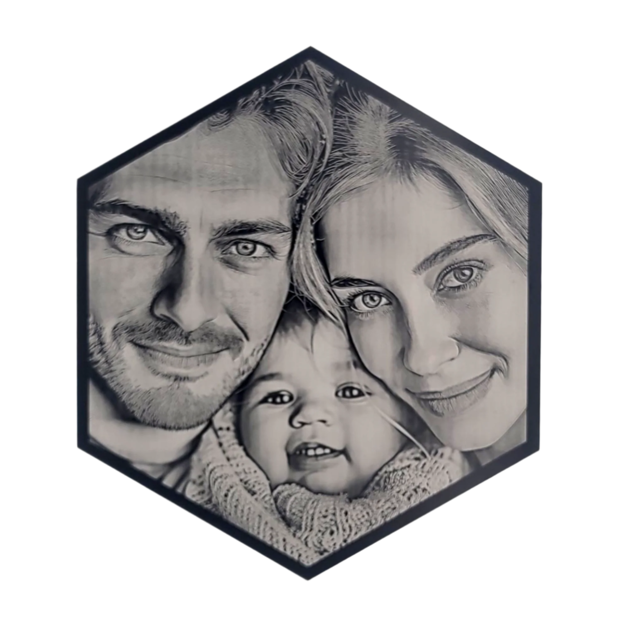 Hexagonal black-and-white portrait of a smiling family with two adults and a baby.
